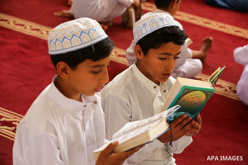 Palestinian children read holy Koran in mosque during the holy month of Ramadan amid the coronavirus COVID-19 pandemic, in Deir al-Balah in the center of Gaza Strip on May 09, 2021. Photo by Ashraf Amra