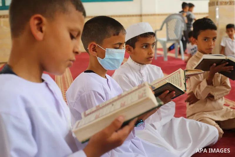 Palestinian children read holy Koran in mosque during the holy month of Ramadan amid the coronavirus COVID-19 pandemic, in Deir al-Balah in the center of Gaza Strip on May 09, 2021. Photo by Ashraf Amra