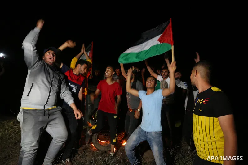 Palestinian protesters burn tires during a demonstration along the Israel-Gaza border, east of Al-Bureij camp, in the center of the Gaza Strip in solidarity the Palestinians in Jerusalem's Sheikh Jarrah neighbourhood, wh...