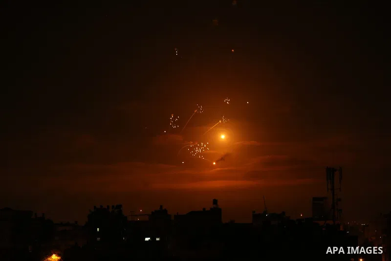 Rockets light up the night sky as they are fired towards Israel from Beit Lahia in the northern Gaza Strip on May 14, 2021. - Israel pounded Gaza and deployed extra troops to the border as Palestinians fired barrages of...