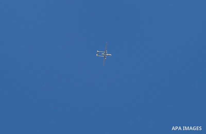 An Israeli drone is seen over Gaza city, on May 15, 2021. Israeli air strikes pounded the Gaza Strip, killing 10 members of an extended family and demolishing a key media building, while Palestinian militants launched ro...
