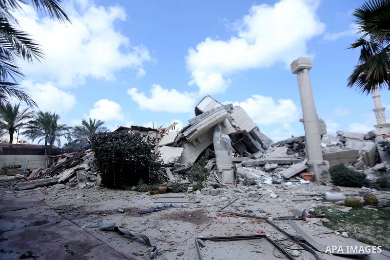 Palestinians inspect the rubbles of the villa of Al-Khaladi after it is destroyed in an Israeli airstrike in the nothern Gaza strip on May 17, 2021. At least 197 people in the besieged Palestinian enclave were killed, in...