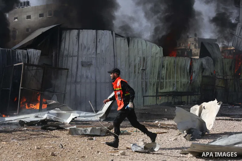 Palestinian firefighters douse a huge fire at the Foamco mattress factory following an Israeli airstrike, east of Jabalia in the northern Gaza Strip on May 17, 2021. Photo by Ashraf Amra
