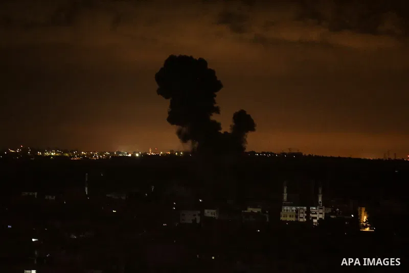 Fire and smoke rise above buildings in the east of Gaza City as Israeli warplanes target the Palestinian enclave, on May 18, 2021. Photo by Bashar Taleb