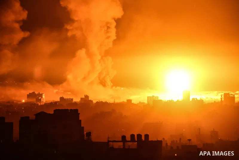 Fire and smoke rise above buildings in Gaza City as Israeli warplanes target the Palestinian enclave, on May 18, 2021. Photo by Bashar Taleb