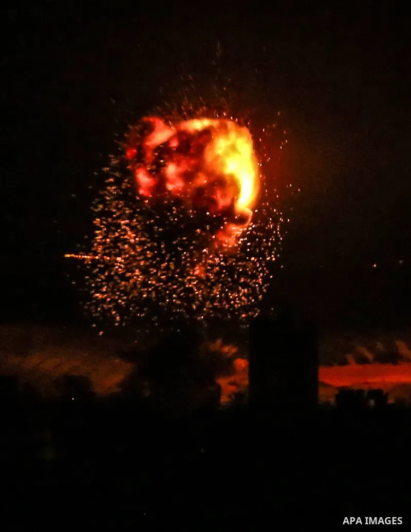 Fire and smoke rise above buildings in Gaza City as Israeli warplanes target the Palestinian enclave, on May 18, 2021. Photo by Bashar Taleb
