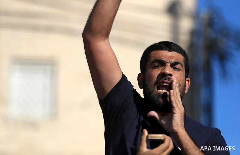 Palestinians protesting against Israel's occupation and its air campaign on the Gaza strip, shout slogans as they face Israeli troops, in the West Bank city of Jenin, on May 18, 2021. Heavy air strikes and rocket fire in...