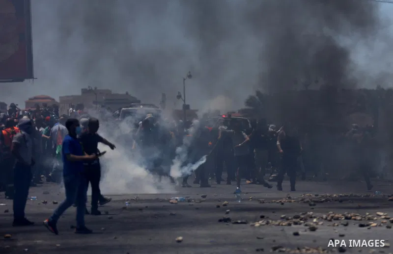 Palestinian protesters clash with Israeli soldiers against Israel's occupation and its air campaign on the Gaza strip near the settlement of Beit El and Ramallah in the occupied West Bank on May 18, 2021. Heavy air strik...