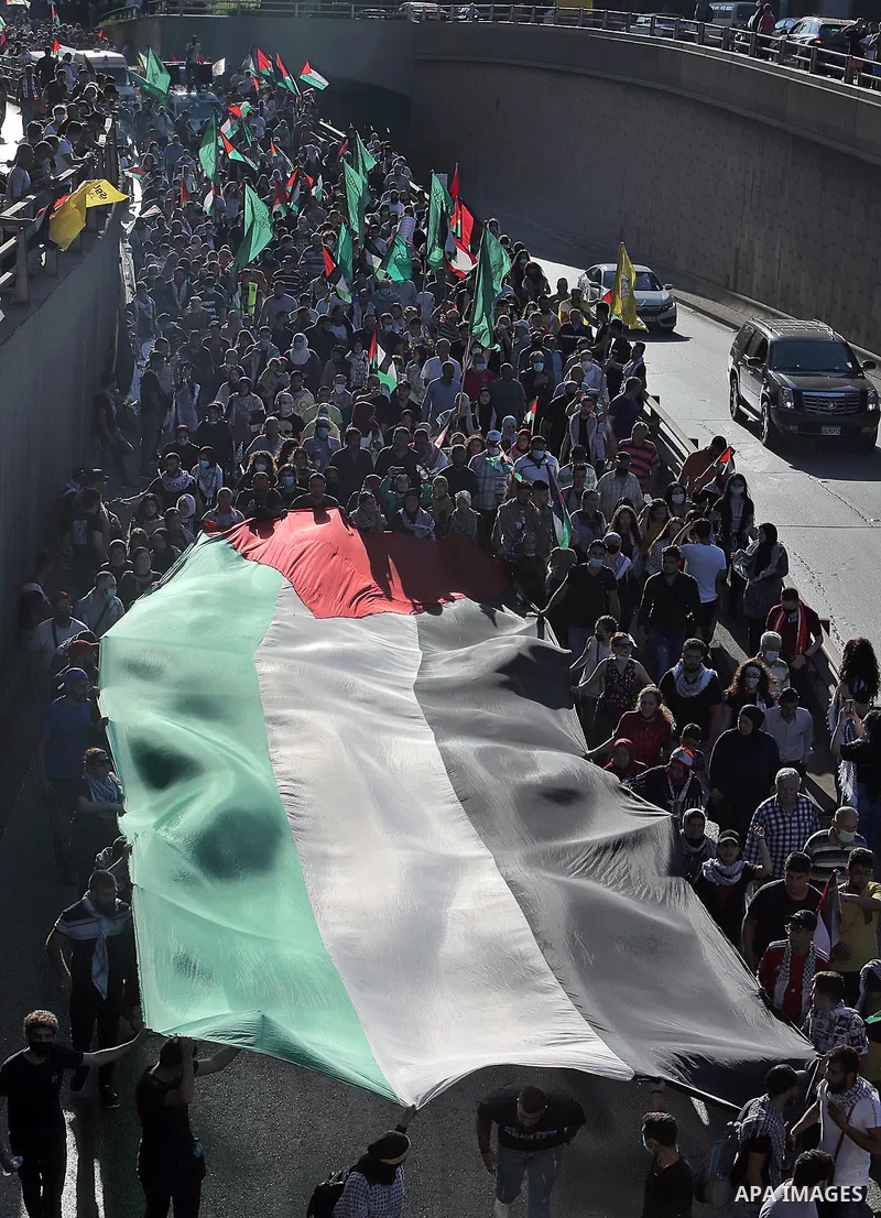 Lebanese wave Palestine flags during a rally in support of Palestinian, in Beirut, Lebanon, 18 May 2021. Heavy air strikes and rocket fire in the Israel-Gaza conflict claimed more lives on both sides as tensions flared i...