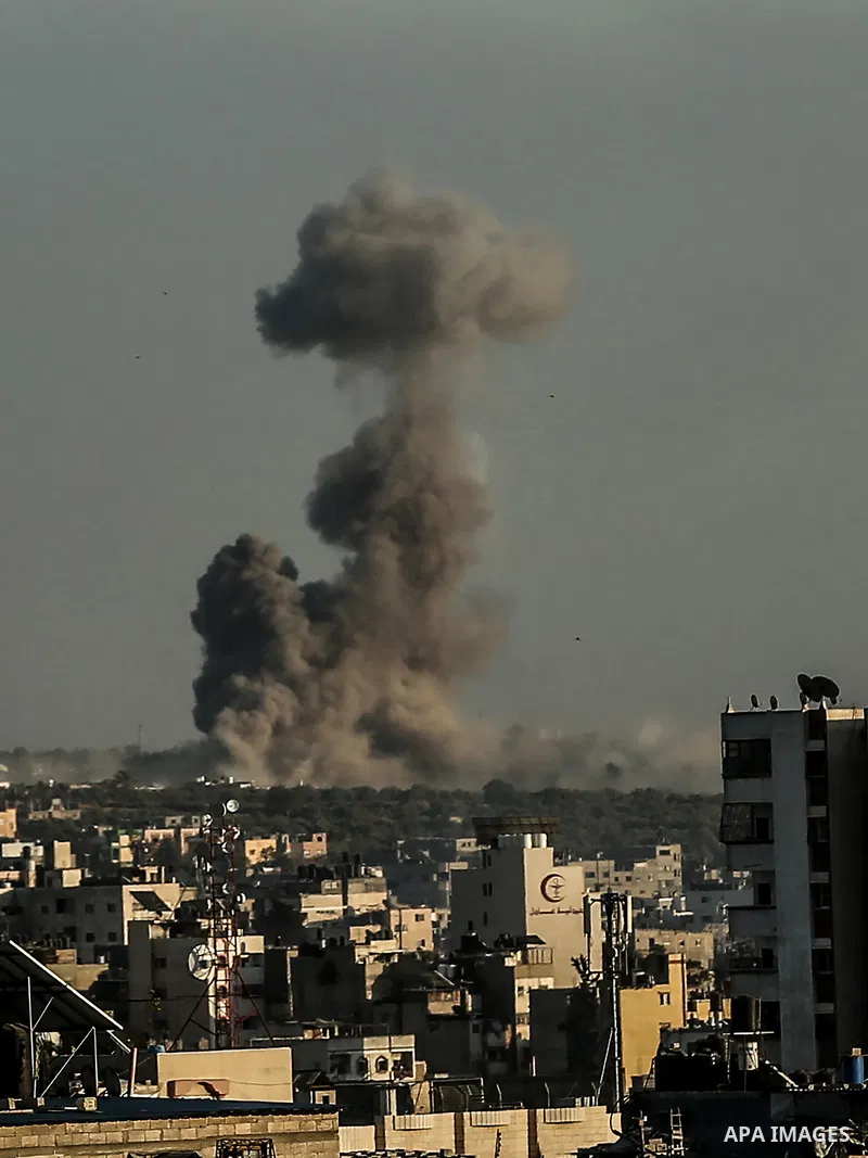 Smoke billows following an Israeli airstrike on Gaza City on May 19, 2021. Deafening air strikes and rocket fire once more shook Gaza overnight and early Wednesday amid an international diplomatic push to broker a ceasef...