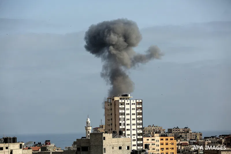 Smoke billows following an Israeli airstrike on Gaza City on May 20, 2021. Deafening air strikes and rocket fire once more shook Gaza overnight and early Thursday amid an international diplomatic push to broker a ceasefi...