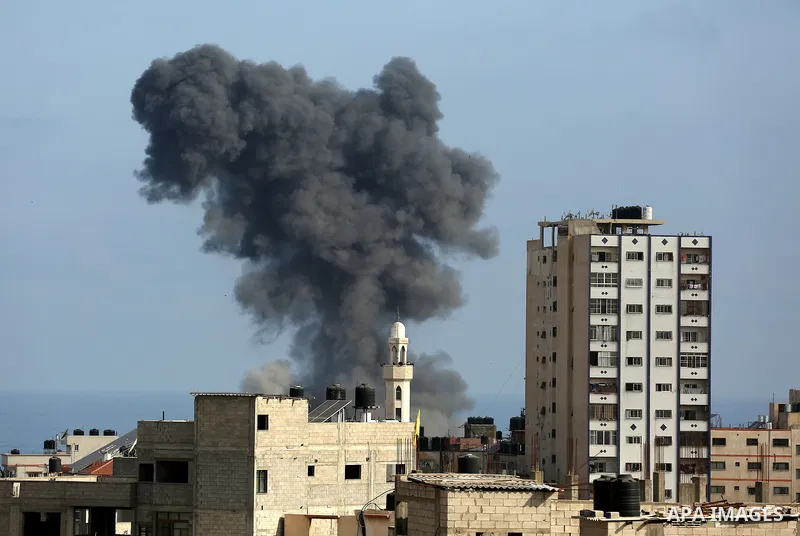 Smoke billows following an Israeli airstrike on Gaza City on May 20, 2021. Deafening air strikes and rocket fire once more shook Gaza overnight and early Thursday amid an international diplomatic push to broker a ceasefi...