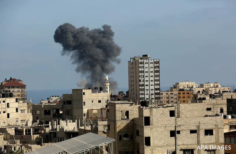 Smoke billows following an Israeli airstrike on Gaza City on May 20, 2021. Deafening air strikes and rocket fire once more shook Gaza overnight and early Thursday amid an international diplomatic push to broker a ceasefi...
