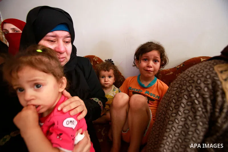 Relatives of Palestinian Diama Assalea, 11, cry during her funeral following an Israeli air strike amid Israeli-Palestinian fighting, in Jabalia, in the northern Gaza Strip, on May 20, 2021. - Israel and the Palestinians...