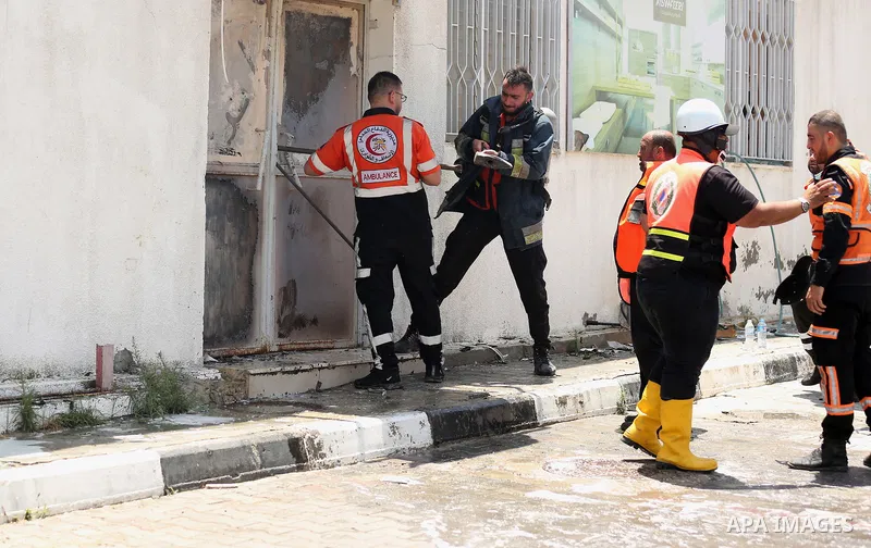 Palestinian firefighters douse a huge fire at the Industrial Area following an Israeli airstrike, east of Gaza City on May 20, 2021. Israel and the Palestinians are mired in their worst conflict in years as Israel pounds...