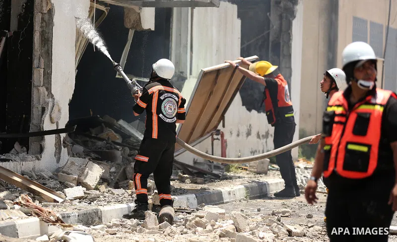 Palestinian firefighters douse a huge fire at the Industrial Area following an Israeli airstrike, east of Gaza City on May 20, 2021. Israel and the Palestinians are mired in their worst conflict in years as Israel pounds...