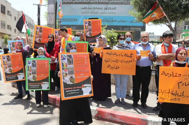 Palestinian members Boycott movement BDS, take part during to boycott Israeli products, in the West Bank city of Hebron on May 20, 2021. Israel and the Palestinians are mired in their worst conflict in years as Israel po...