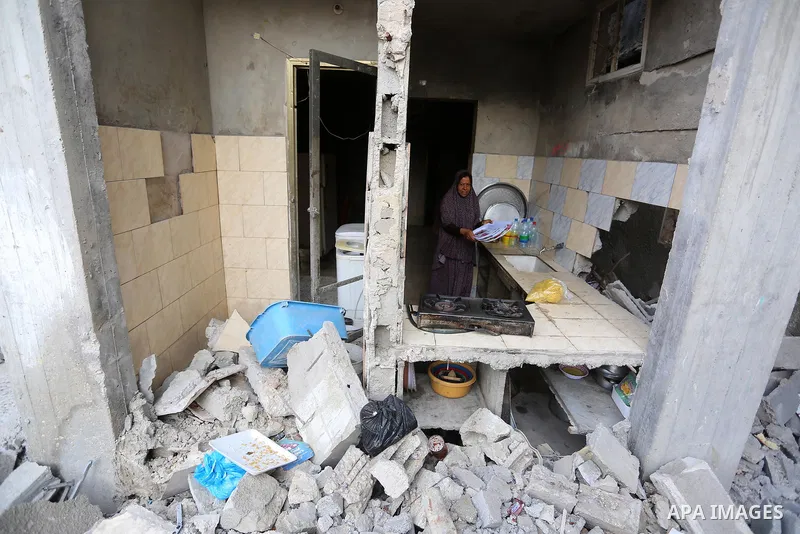 Palestinians return to their houses which were destroyed by Israeli strike, in Beit Hanoun, in the northern Gaza Strip, after a ceasefire brokered by Egypt between Israel and Hamas, on May 21, 2021. A ceasefire between I...