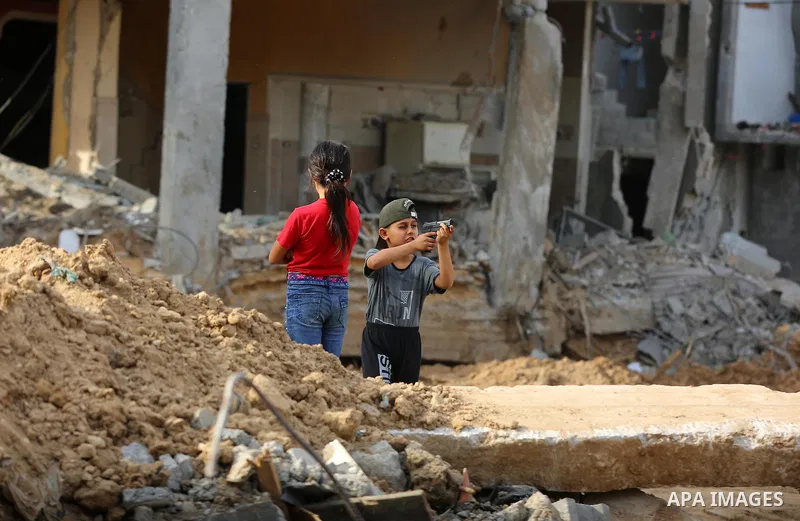 Palestinians return to their houses which were destroyed by Israeli strike, in Beit Hanoun, in the northern Gaza Strip, after a ceasefire brokered by Egypt between Israel and Hamas, on May 21, 2021. A ceasefire between I...