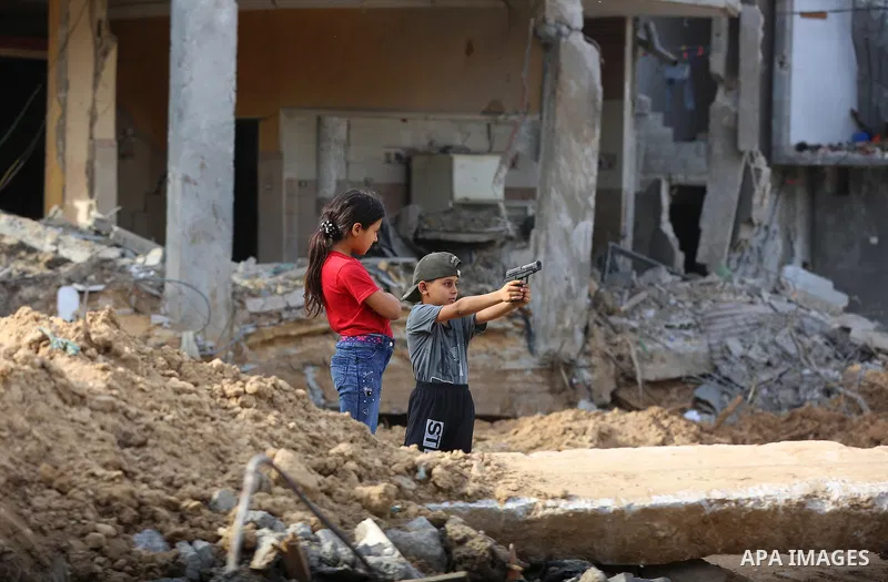 Palestinians return to their houses which were destroyed by Israeli strike, in Beit Hanoun, in the northern Gaza Strip, after a ceasefire brokered by Egypt between Israel and Hamas, on May 21, 2021. A ceasefire between I...
