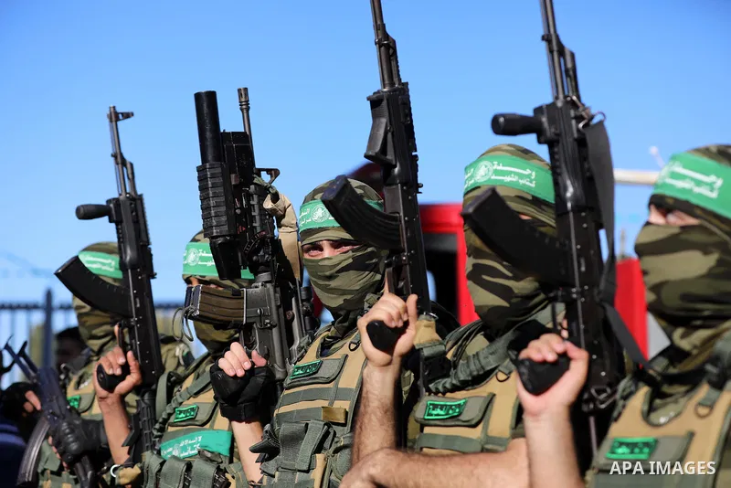 Members of Al-Qassam Brigades, the armed wing of the Hamas movement, attend a rally in Gaza City on May 24, 2021. A ceasefire was reached late last week after 11 days of deadly violence between Israel and the Hamas movem...