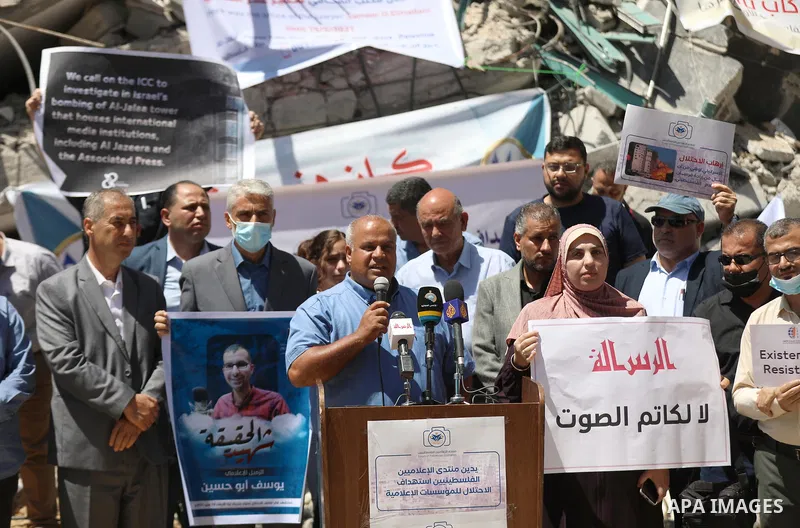 Palestinian Journalists take part in a protest on the 72 Violation against Media Freedoms during the Escalation on the Gaza Strip, in front of Jala' Tower which destroyed on May 15 during Israeli air-strike in Gaza city...