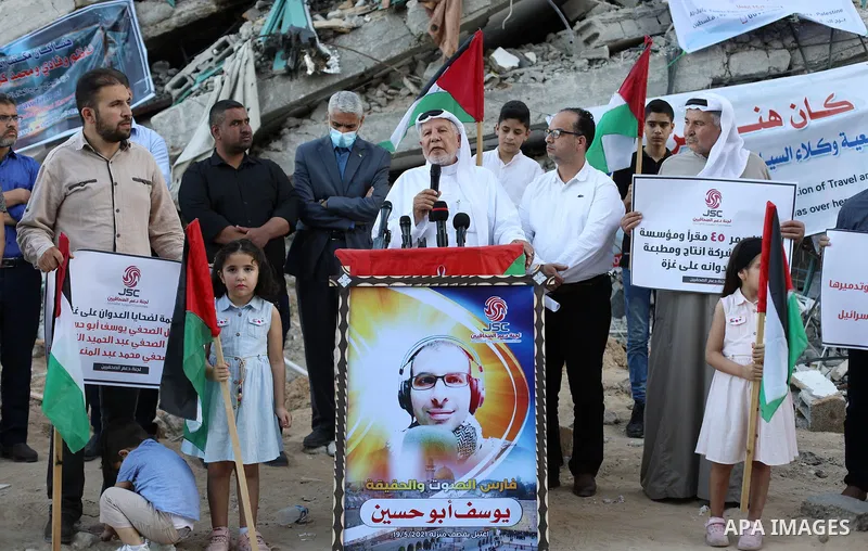 Palestinian Journalists take part in a protest on the Violation against Media Freedoms during the escalation on the Gaza Strip, in front of Jala' Tower which destroyed on May 15 during Israeli air-strike in Gaza city on...