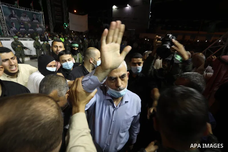 Yahya Sinwar, leader of the Palestinian Hamas movement's political wing attend a military parade in Khan Younis, in the southern Gaza Strip, on May 27, 2021. The Egyptian-brokered truce ended 11 days of heavy Israeli bom...