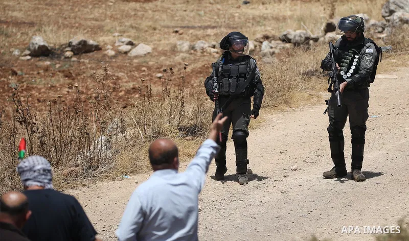 Palestinians clash with Israeli security forces during a demonstration against the establishment of Israeli outposts on their lands, in Beit Dajan, east of Nablus in the occupied West Bank on May 28, 2021. Photo by Shadi...