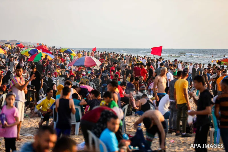 Palestinians spend time at the beach in Gaza May 28, 2021 to escape the hot weather, and the ongoing power cuts. Photo by Atia Darwish