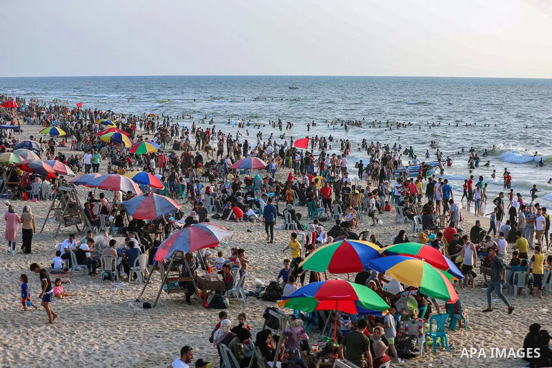 Palestinians spend time at the beach in Gaza May 28, 2021 to escape the hot weather, and the ongoing power cuts. Photo by Atia Darwish