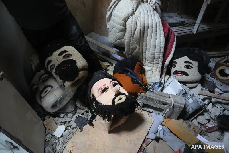 Palestinians inspect the Art House Center destroyed by Israeli missile strikes, in Gaza city, on May 29, 2021. Gaza’s housing ministry said on Thursday that 16,800 housing units had been damaged. Of those, 1,800 had beco...