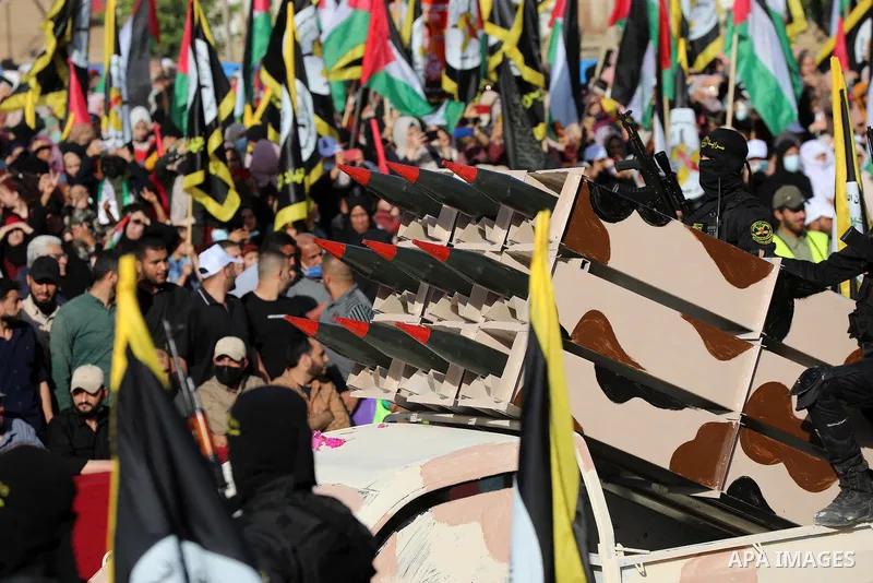 Fighters of al-Quds Brigades, the armed wing of the Palestinian Islamic Jihad movement, parade with their weapons in the streets of Gaza City during a rally, on May 29, 2021, more than a week after a ceasefire brought an...