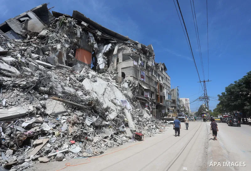 A view shows rubble of shorouq Tower, which destroyed during Israeli air-strike following a cease-fire reached after an 11-day war between Gaza's Hamas and Israel, in Gaza city on May 30, 2021. Gaza’s housing ministry sa...