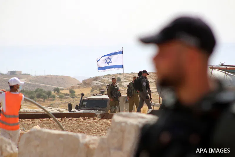 Evicted Palestinian residents pack their belongings during an Israeli demolition of Palestinian homes located within the "Area C" of the occupied West Bank, where Israel retains full control over planning and constructio...