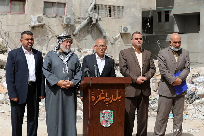 The union of Gaza Strip Municipalities and the Interior and Local Government Committee of the Legislative Council take part in the press conference in front of the Abu Al-Aouf building, that was destroyed by Israeli air...