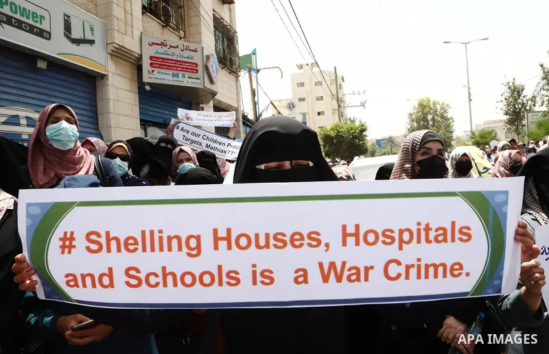 Palestinian employees of United Nations Relief and Works Agency (UNRWA) take part in a protest demanding the departure of Matthias Schmale, the director of operations for the UNRWA, "Matthias Shamali ... Go Out "outside...