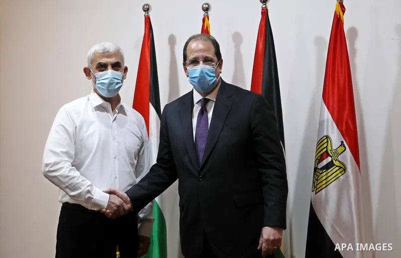 Yahya Sinwar Hamas' political chief in Gaza, shakes hand with General Abbas Kamel Egypt's intelligence chief, as the latter arrives for a meeting with leaders of Hamas in Gaza City on May 31, 2021. Photo by Ashraf Amra