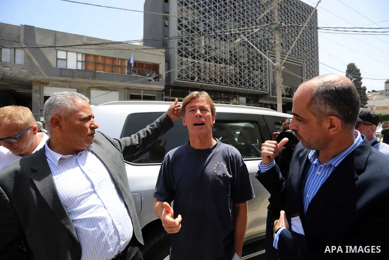 Sven Kühn von Burgsdorff, European Union Representative to the West Bank and Gaza, is given a tour of the ruins of al-Shouroq tower, destroyed by Israeli strikes during the recent confrontations between Hamas and Israel,...