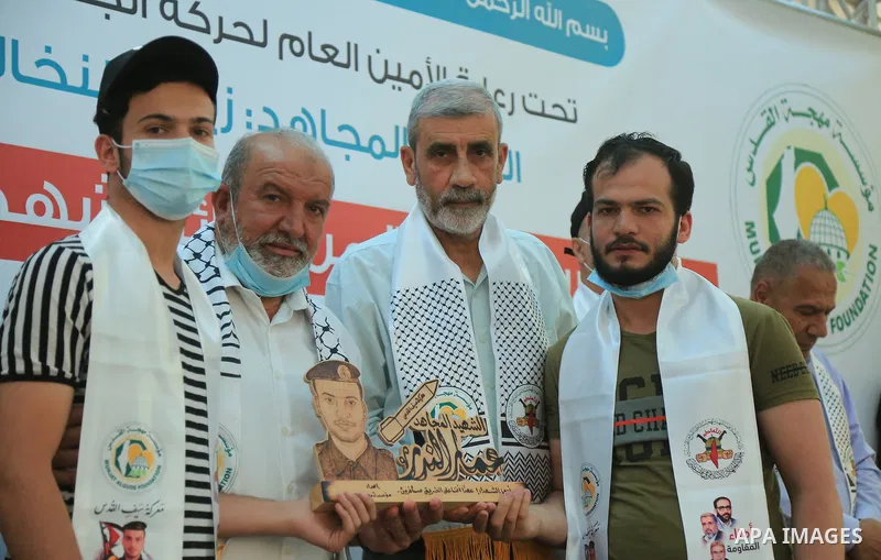 Palestinians attend a ceremony to honor the families of martyrs in Gaza city on June 3, 2021. The Egyptian-brokered truce ended 11 days of heavy Israeli bombing of Gaza and rocket fire from the impoverished coastal encla...