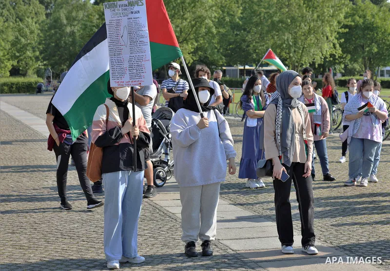 Foreign activists take part during a protest against the killed of Palestinian children at Gaza city by Israeli airstrikes, in front of German Bundestag, in Berlin, Germany, on June 4, 2021. Photo by Manar Shahin