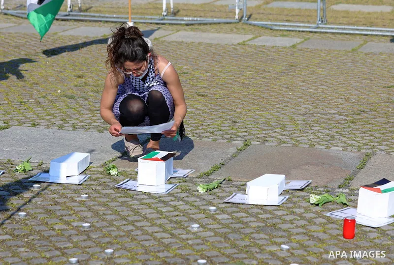 Foreign activists take part during a protest against the killed of Palestinian children at Gaza city by Israeli airstrikes, in front of German Bundestag, in Berlin, Germany, on June 4, 2021. Photo by Manar Shahin