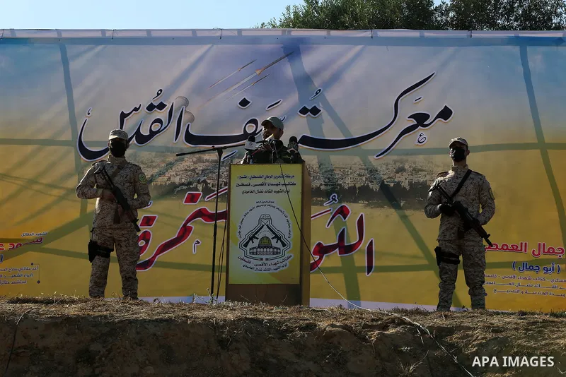 Palestinian militants of Al-Aqsa Martyrs' Brigades, the armed wing of Fatah movement take part in a military parade in an anti-Israel rally, in Khan Younis in the southern of Gaza Strip June 7, 2021. Photo by Abed Deeb