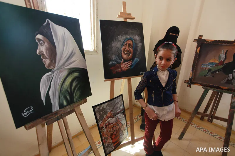 Palestinians attend an exhibition entitled "dirt and stones" at the Arts and Crafts Village in Gaza City, on June 8, 2021. Gaza’s housing ministry said on Thursday that 16,800 housing units had been damaged. Of those, 1,...