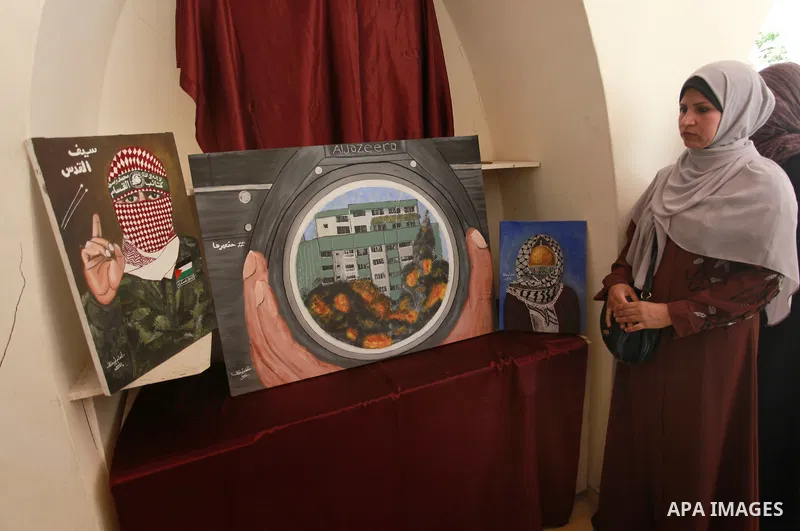 Palestinians attend an exhibition entitled "dirt and stones" at the Arts and Crafts Village in Gaza City, on June 8, 2021. Gaza’s housing ministry said on Thursday that 16,800 housing units had been damaged. Of those, 1,...