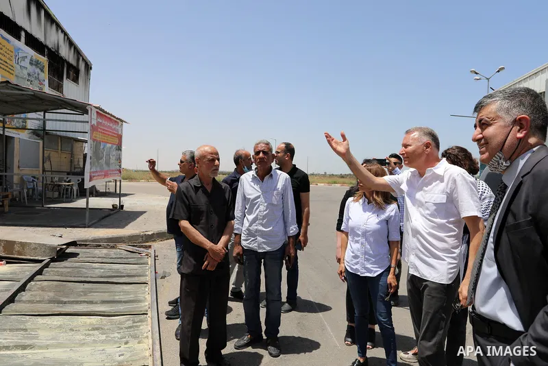 Palestinian businessman and Head of the Board of Directors of "PADICO Holding", Bashar Al-Masry, visits the factories damaged in Gaza's industrial area, which was hit by Israeli strikes, in Gaza city on June 09, 2021. Ga...