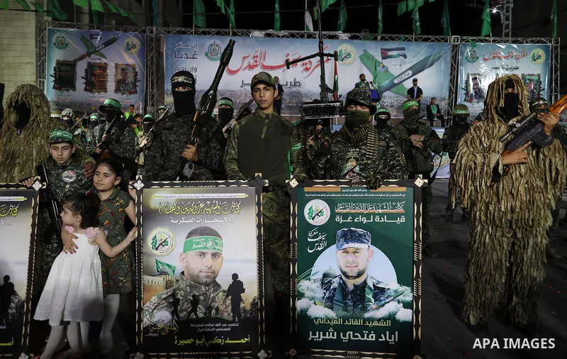 Palestinian supporters of Hamas movement take part in an anti-Israel rally in Gaza city, on June 9, 2021. The Egyptian-brokered truce ended 11 days of heavy Israeli bombing of Gaza and rocket fire from the impoverished c...