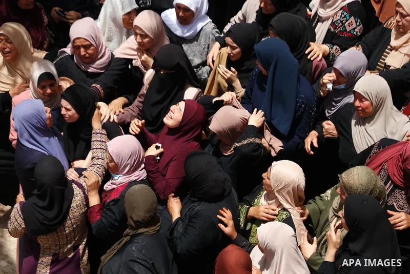 Relatives react during the funeral of Palestinian security man Tayseer Issa, who was killed by Israeli forces according to health ministry in the Werst bank city of Jenin, on June 10, 2021. Photo by Oday Daibes