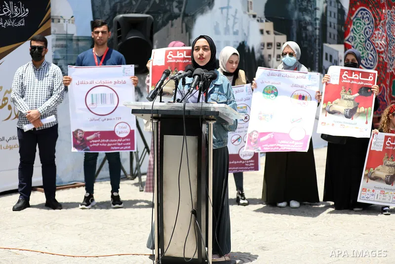 Palestinian members of boycott movement BDS hold a press conference during National Economy Week in Gaza city on June 10, 2021. Photo by Stringer