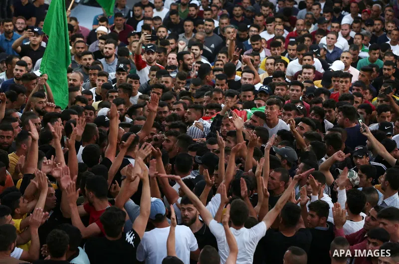 Palestinian mourners carry the body of Mohammad Hamayel, 15, killed earlier today in confrontations with Israeli security forces following a demonstration, during his funeral in the village of Beita, south of Nablus in t...